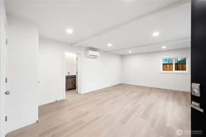 Waterproof luxury vinyl flooring in large light filled living area and kitchen