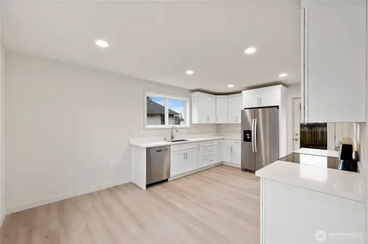This stunning kitchen has room for a large dining room table
