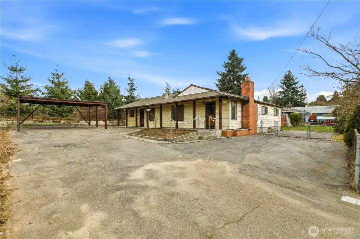 Excellent parking with oversized carport/ paved fenced side yard (RV or Boat?)