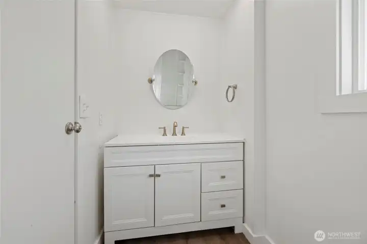 Updated vanity and finishes in primary bath