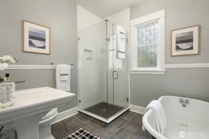 Remodeled bath with soaking tub and separate shower.