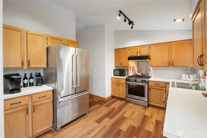 Kitchen with new paint SS appliances and NEW flooring