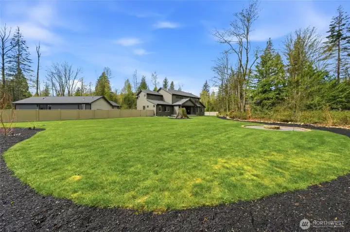 Expasnsive fully fenced Backyard with Firepit