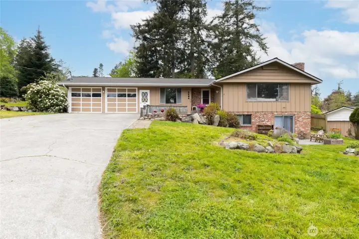 Spacious home with a versatile lower level, oversized garage, and mature landscaping, all set in an established neighborhood with a welcoming feel.