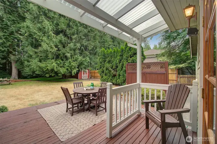 Indoors extend outdoors through French doors. Wall and row of Cypress encloses an additional parking area for your RV