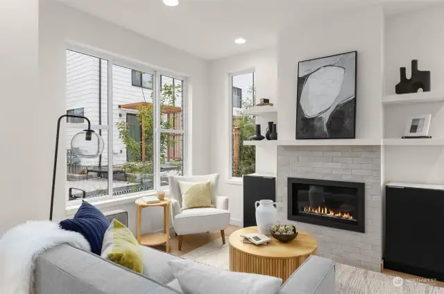 Experience comfort and style in this open-concept living space, perfect for entertaining or unwinding by the cozy fireplace.