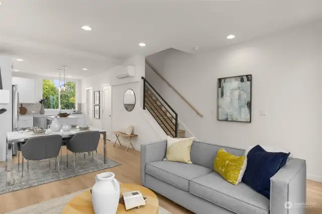 An alternate view of the living room showcases its spaciousness and the flow into the dining and kitchen areas, creating a harmonious living space.