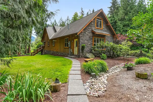 Traditional architectural design, English cottage stone & timber. - Looking at the side view of home and garage.