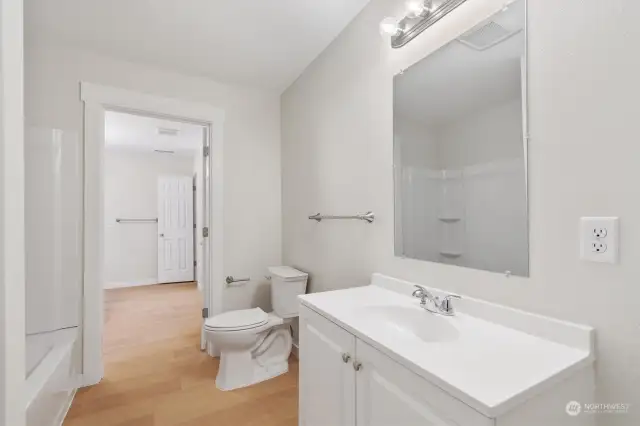 Main bath in the hallway, connects to master bath