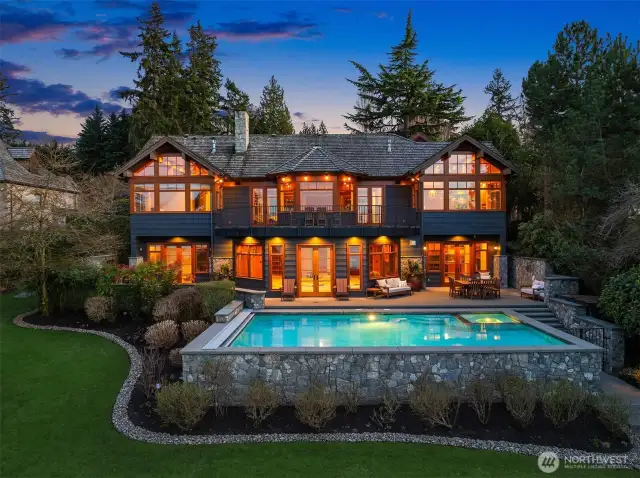 Welcome to an exquisite waterfront estate where timeless elegance meets modern luxury. Custom built with extraordinary craftsmanship and meticulous attention to detail, this peaceful retreat offers breathtaking panoramic views and an unrivaled waterfront lifestyle.