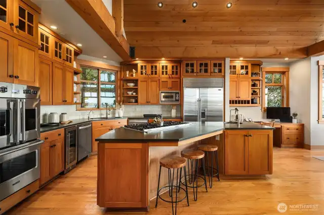 Ample storage with newly restored, warm wood cabinetry & a walk-in pantry just off the kitchen.