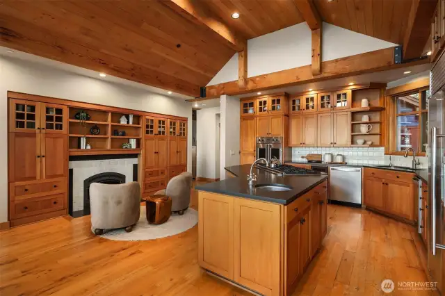Cozy gas fireplace and built-ins complete this special kitchen.