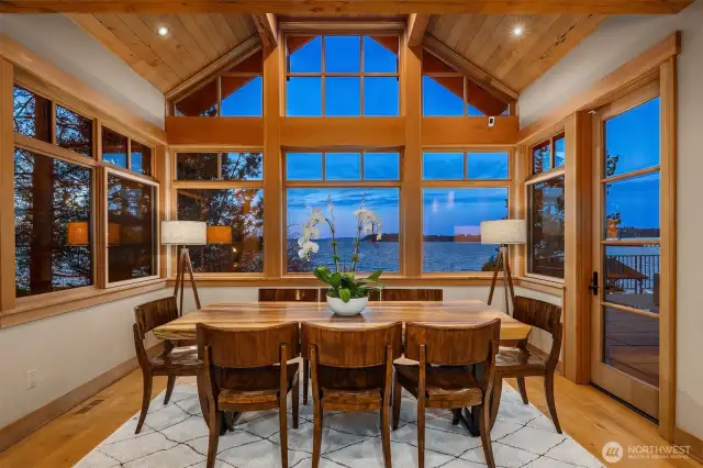 Soaring breakfast nook with wall of windows brining the lake views in!
