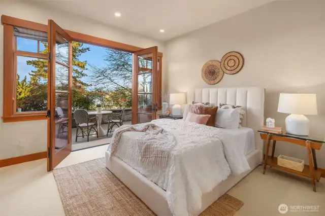 Light-filled guest bedroom on the lower level with private French doors opening out to backyard patio & pool. En suite 3/4 bathroom & walk-in closet complete the room.