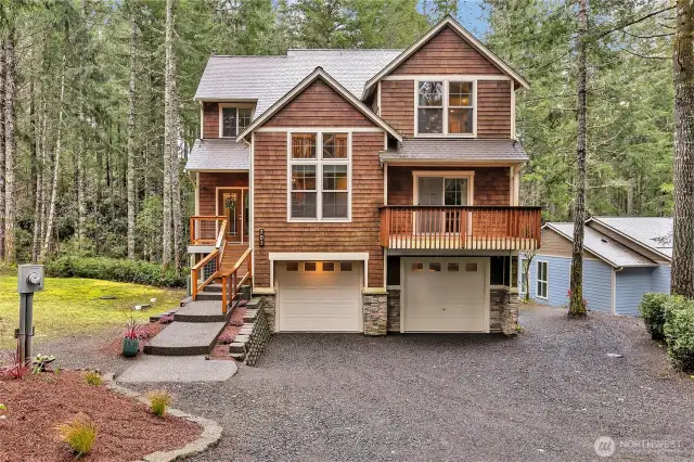 Gorgeous custom home in the exclusive Alderbrook community welcomes you! Notice the eight foot garage doors that lead to the 994 sq. ft. garage plus there is additional parking to the side!