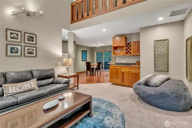 The living room has soring ceilings which gives much light to the area. The custom 'sky-bridge' at the top connects the access to the bedrooms.
