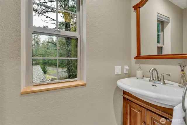 The powder room is located off the family room.