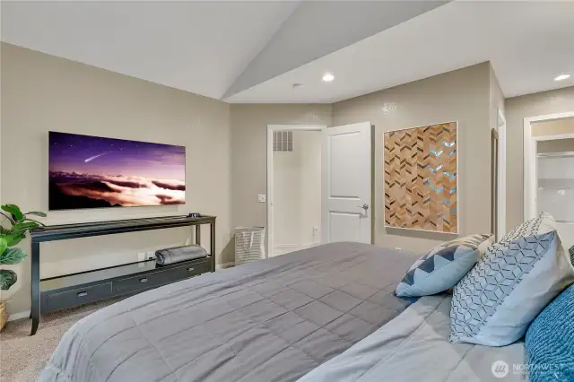 Here's the second view of the primary suite and to the right is the walk-in closet and en-suite bathroom.