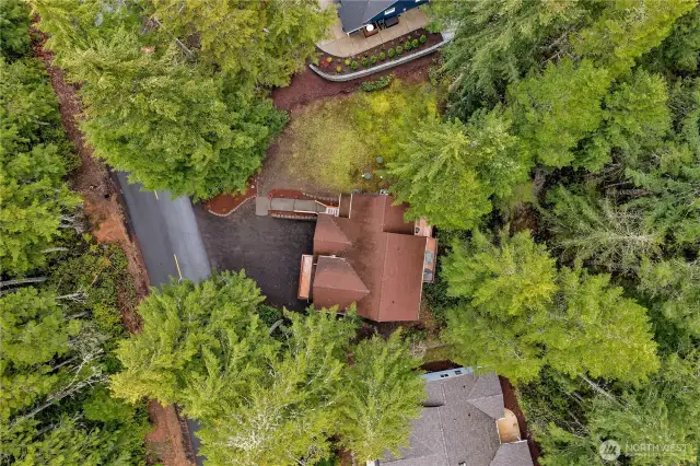 This is the aerial view of the home. To the one side is a level area which makes a great yard space.