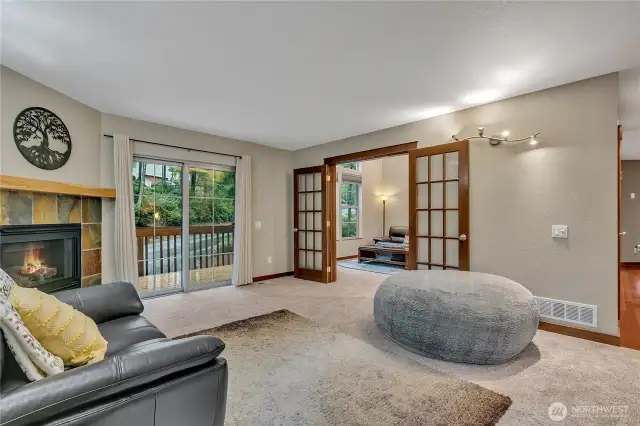 From the family room you can see into the living room. Beautiful French doors offer the option to separate both living areas if you choose.