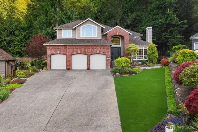 Sitting up high and back, this traditional home is so welcoming.
