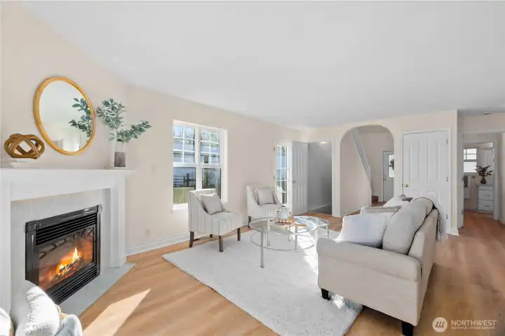 The arched doorway leads to the 2-story foyer and the door to the left goes to the lower level where you will find a bonus room, laundry room and 2-car garage. Door to the right leads into a bathroom.