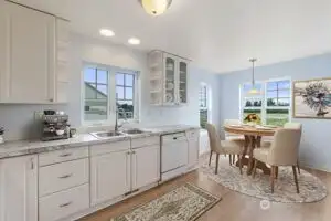 Virtually staged kitchen nook is cheery place for morning coffee.