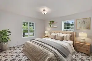 Virtually staged primary bedroom on main floor.  Primary bath is to the left.
