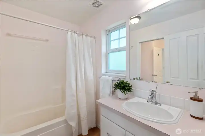 Primary bath with a  tub/shower and a separate sink really make this a functional layout.