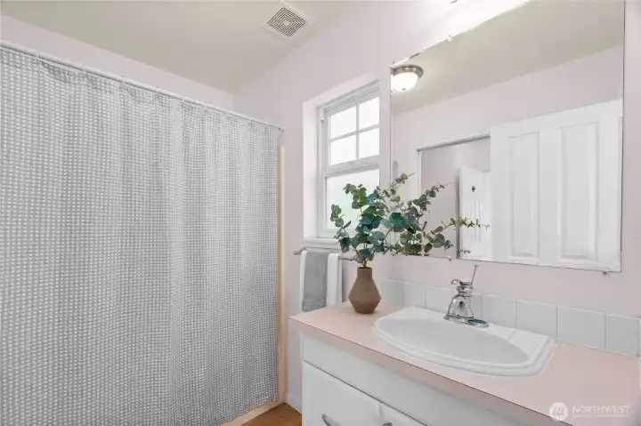 The primary bath is on the main level & has two sinks.  One area has a sink and the tub/shower.  A pocket door can be closed to isiolate the second sink and water closet that guests can access from the living area.