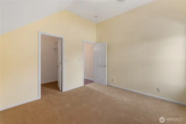 The second upstairs bedroom also has a window that looks out over the side yard & provides a fresh, bright space. There is a vaulted ceiling & another walk-in closet.