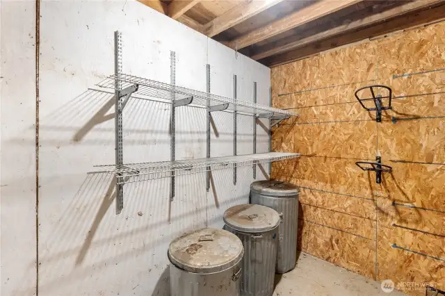Tack room with saddle racks, shelving and plenty of space for feed storage.