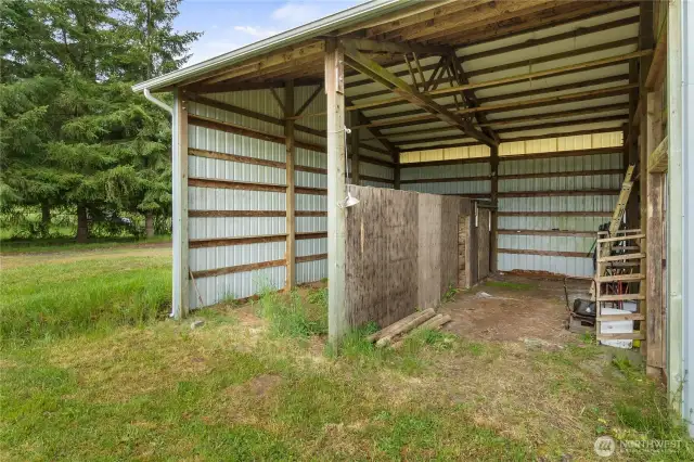 The second farm building can easily  house trailers, RVs or farm equipment undercover to protect them from the elements.  Or store shavings on one side and park on the other.