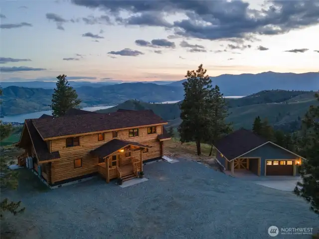 Exterior twilight view of home overlooking Lake Chelan.