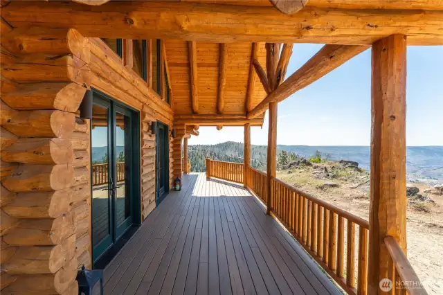 Exterior view of covered wraparound porch with views overlooking Lake Chelan.