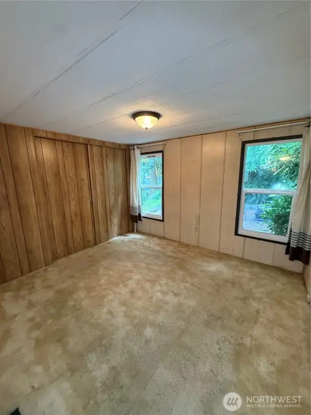 This is the largest bedroom and at the back of the house. Windows overlook the backyard.