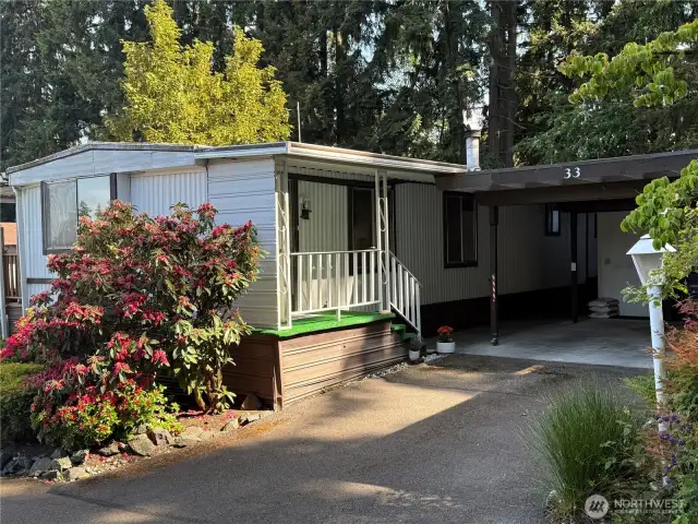 Back porch and carport. Lockbox is on this door for access.