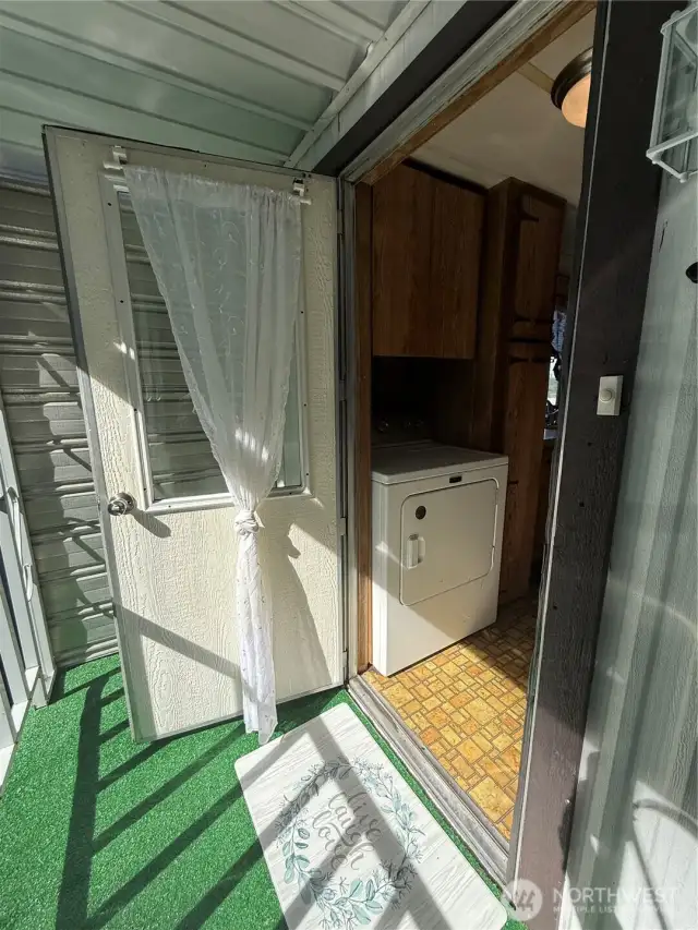 This is the back door entry into the utility room and into the kitchen.