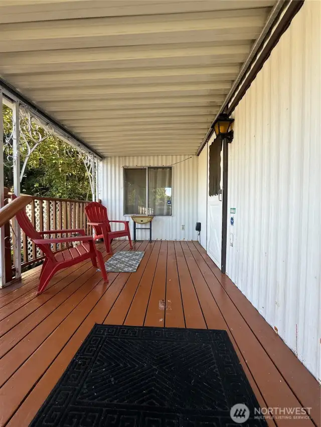 Front covered porch / deck leads to the front door of the house.