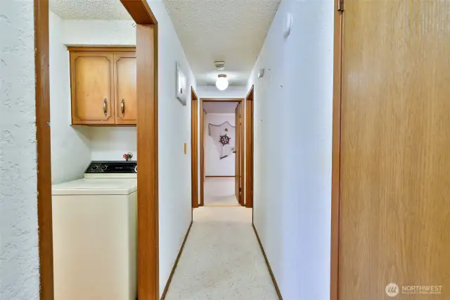 Hallway leading to the Primary Bedroom and Sun Room.