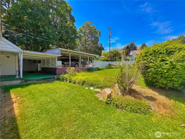 Fenced back yard and 242sf covered patio is great for outdoor entertaining.