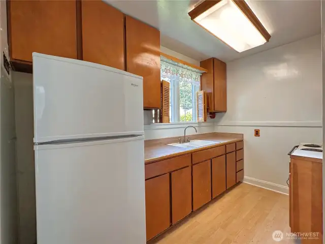 Kitchen space, appliances as seen convey with sale.