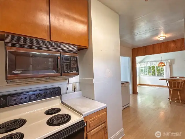 Stove/range and microwave stay with home.