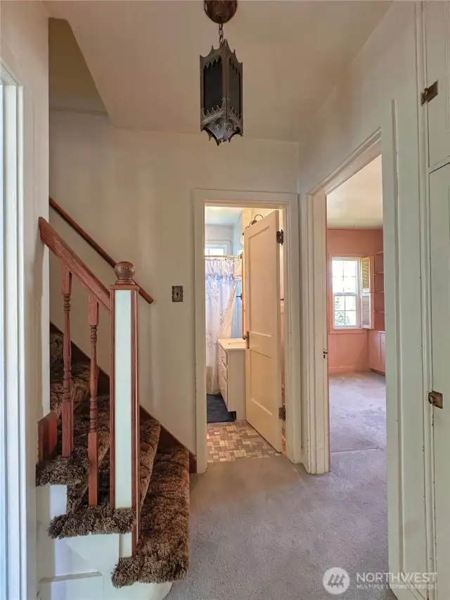 Hallway to main level and upper bedrooms and bathroom.
