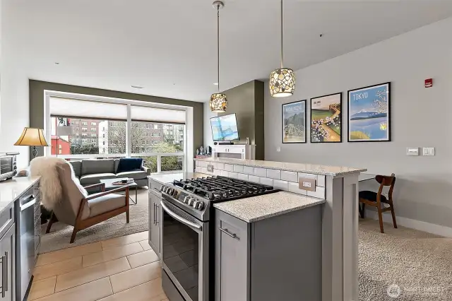 The kitchen flows effortlessly into a spacious living area.