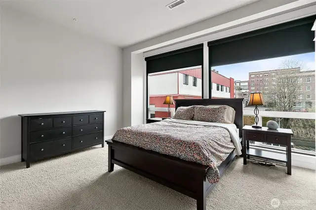 The expansive windows provide an ever-changing panorama that perfectly captures the essence of city living.