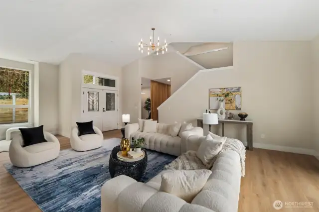 Living room leads to office space, stairs, bathroom and kitchen.