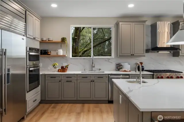 New kitchen with sub zero refrigerator and quartz countertops.
