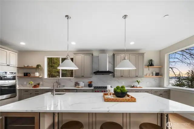 Spacious kitchen island with prep sink. View of Lake Washington from the window.