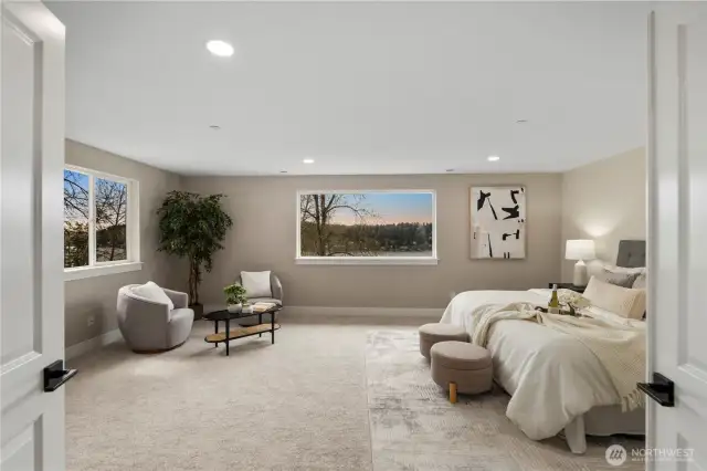 Spacious primary bedroom upstairs with views of Lake Washington.